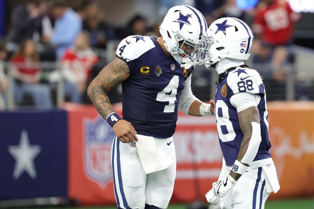 Dallas Cowboys Dak Prescott #4 and CeeDee Lamb #88 celebrate a touchdown.