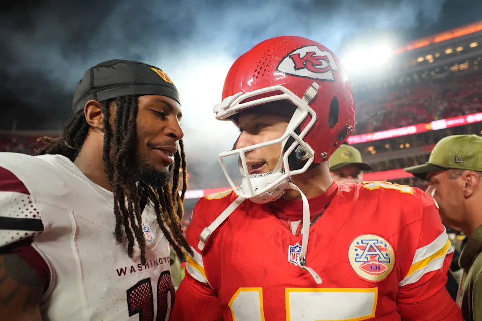 Washington Commanders safety Tyler Owens speaks to Kansas City Chiefs quarterback Patrick MahomesJay Biggerstaff-Imagn Images