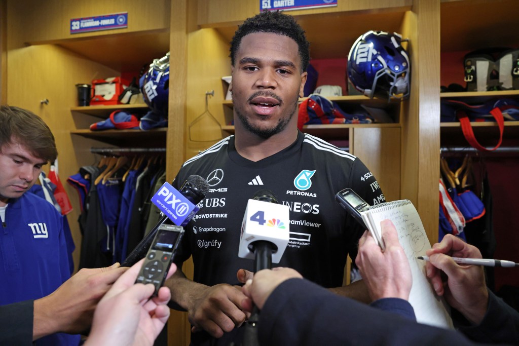 New York Giants linebacker Abdul Carter (51) speaks to the media in the locker room.