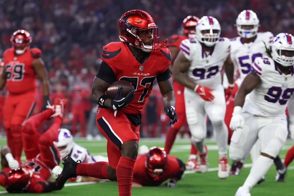 Nov 20, 2025; Houston, Texas, USA; Houston Texans running back Woody Marks (27) runs against the Buffalo Bills in the first quarter at NRG Stadium. Mandatory Credit: Troy Taormina-Imagn Images