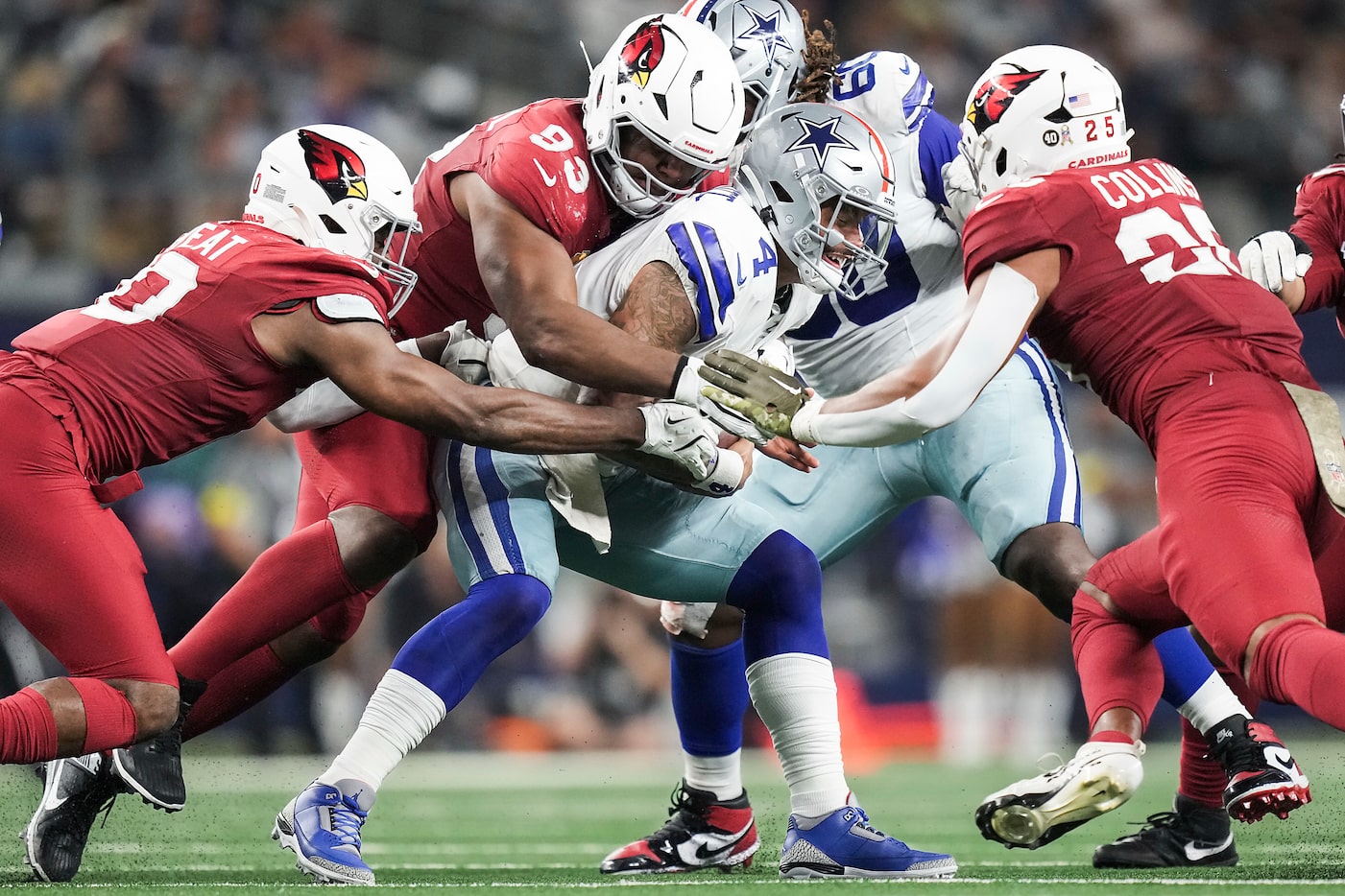 Dallas Cowboys quarterback Dak Prescott (4) is sacked by Arizona Cardinals defensive tackle...