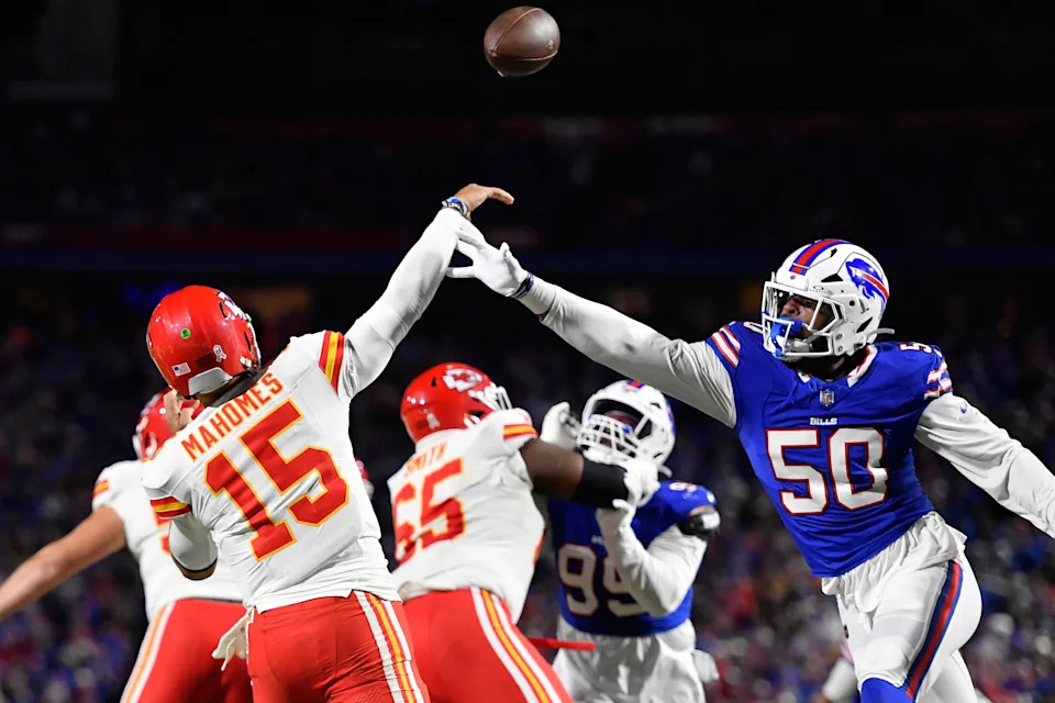 Kansas City Chiefs quarterback Patrick Mahomes throws under pressure from Buffalo Bills defensive end Greg Rousseau (Adrian Kraus/AP)