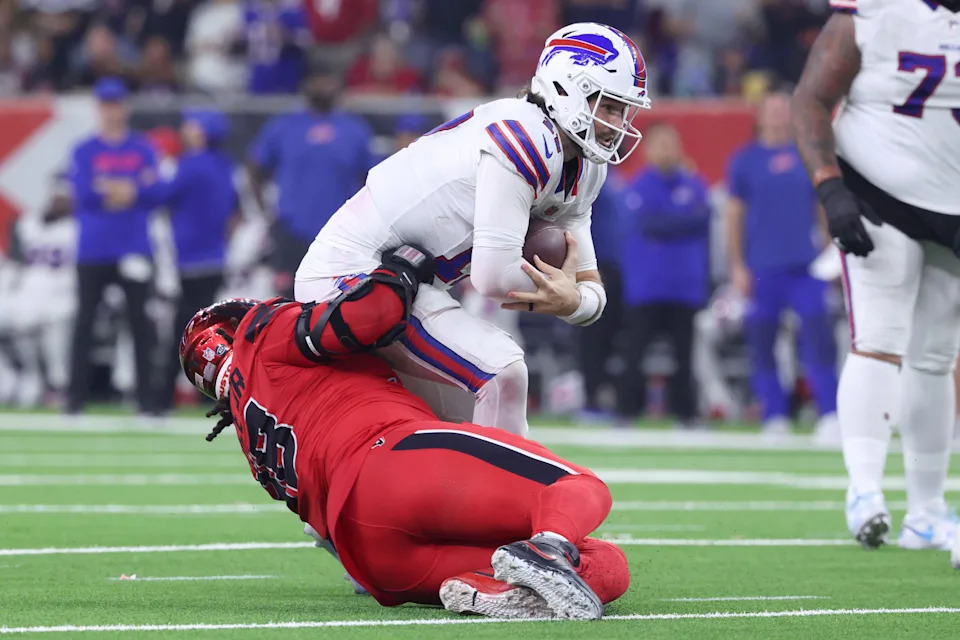 Nov 20, 2025; Houston, Texas, USA; Houston Texans defensive tackle Tim Settle Jr. (98) sacks Buffalo Bills quarterback Josh Allen (17) in the second half at NRG Stadium. Mandatory Credit: Troy Taormina-Imagn Images