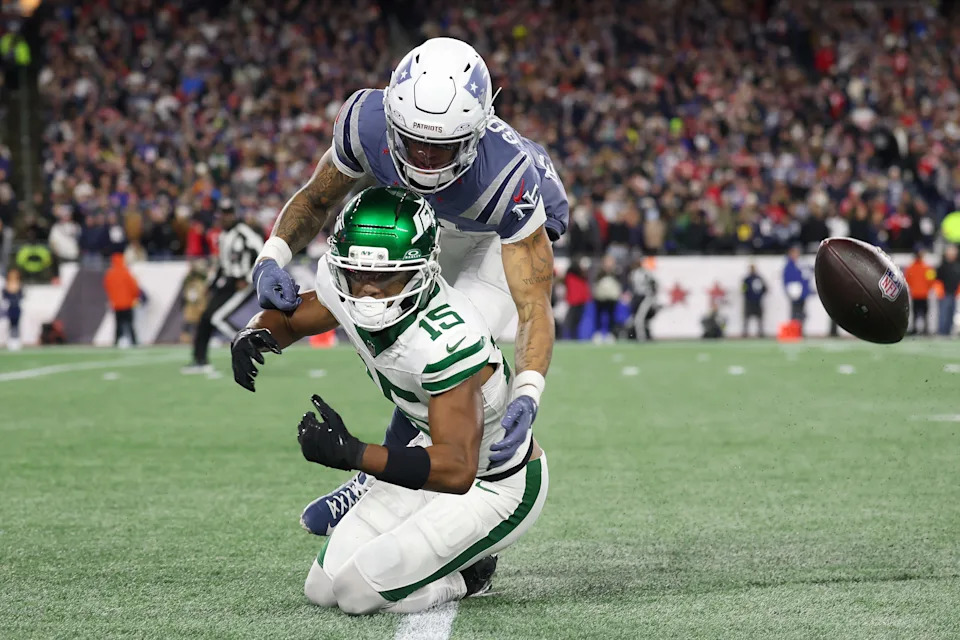 FOXBOROUGH, MASSACHUSETTS - NOVEMBER 13: Christian Gonzalez #0 of the New England Patriots breaks up a pass intended for Adonai Mitchell #15 of the New York Jets during the first half at Gillette Stadium on November 13, 2025 in Foxborough, Massachusetts. (Photo by Maddie Meyer/Getty Images)