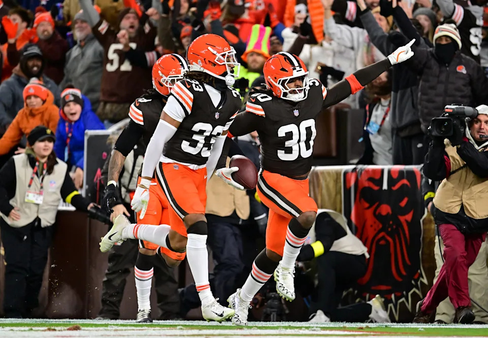 Nov 16, 2025; Cleveland, Ohio, USA; Cleveland Browns linebacker Devin Bush (30) celebrates with safety Ronnie Hickman Jr. (33) after returning an interception for a touchdown during the second quarter against the Baltimore Ravens at Huntington Bank Field. Mandatory Credit: Ken Blaze-Imagn Images