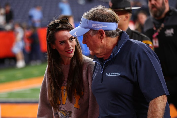 Jordon Hudson speaks with Bill Belichick of the North Carolina Tar Heels after a game against the Syracuse Orange at JMA Wireless Dome on October 31, 2025 in Syracuse, New York.
