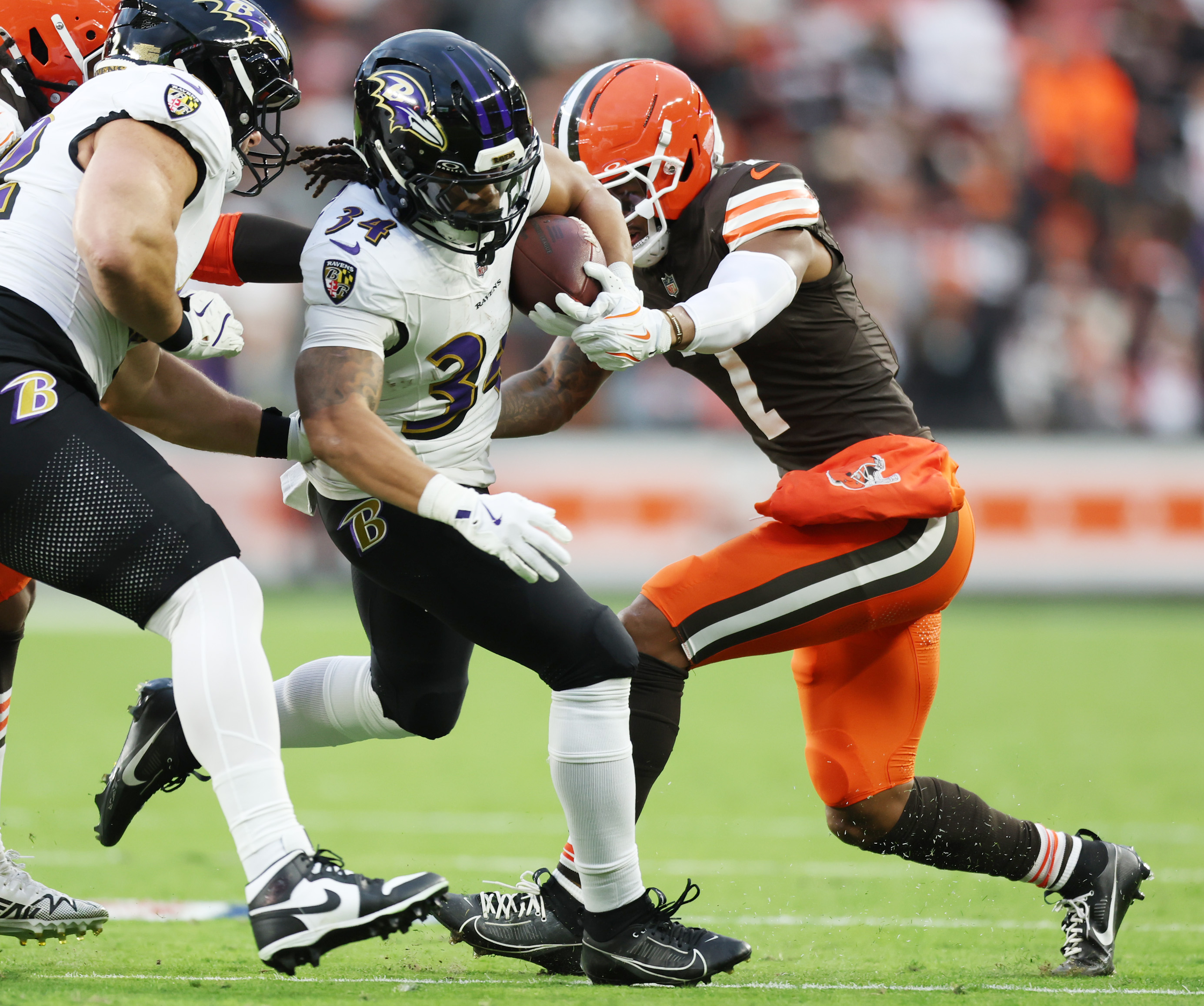 Baltimore Ravens running back Keaton Mitchell is eventually pushed out of bounds own a rush in the first quarter by Cleveland Browns cornerback Tyson Campbell Baltimore at Huntington Bank Field.