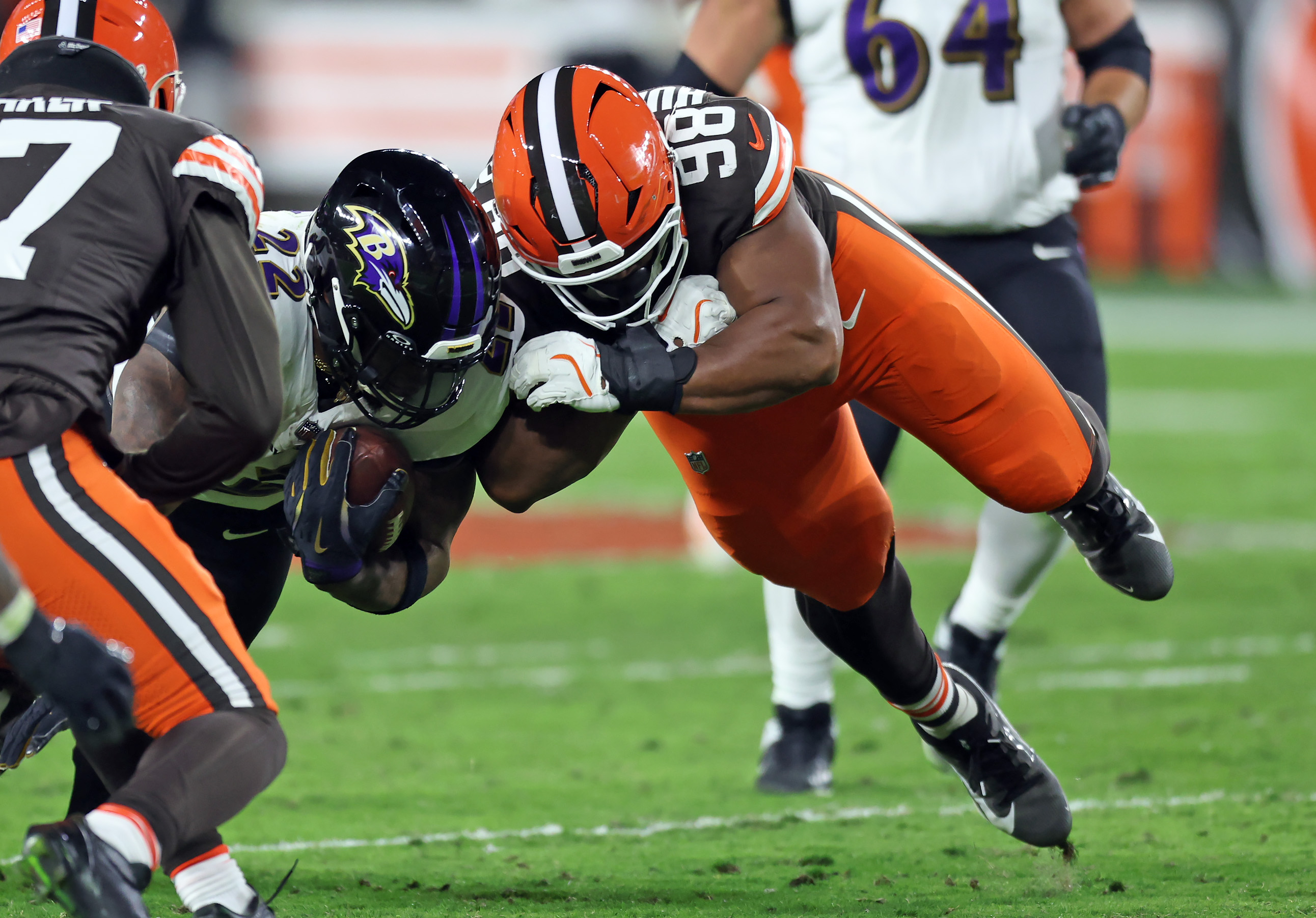 Cleveland Browns defensive end Adin Huntington puts a hit on Baltimore Ravens running back Derrick Henry in the second half of play. 