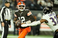 Cleveland Browns quarterback Shedeur Sanders (12) looks to pass against Baltimore Ravens...