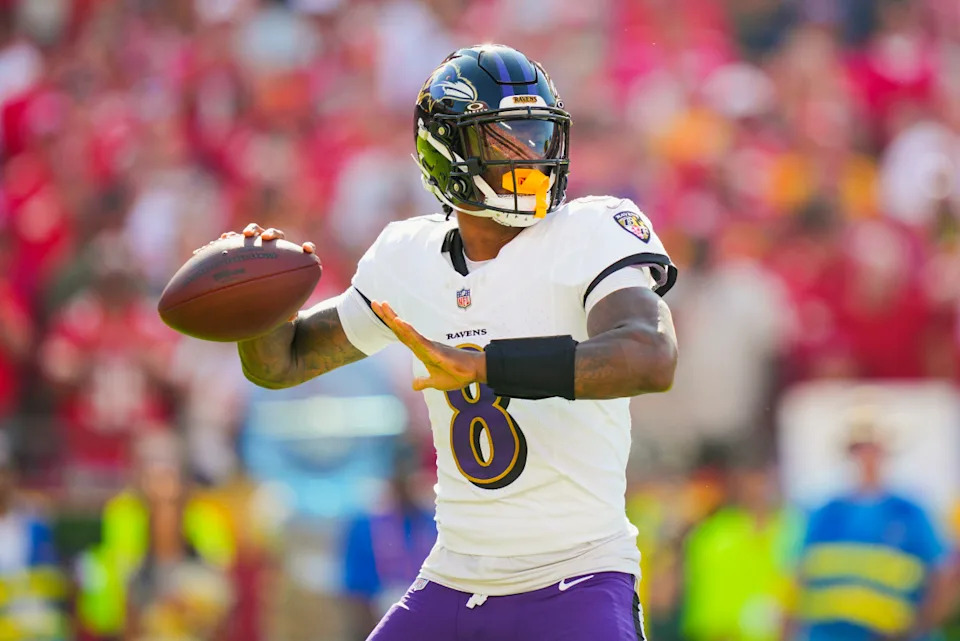 Baltimore Ravens quarterback Lamar Jackson (8) throws a pass during the first half against the Kansas City Chiefs at GEHA Field at Arrowhead Stadium.