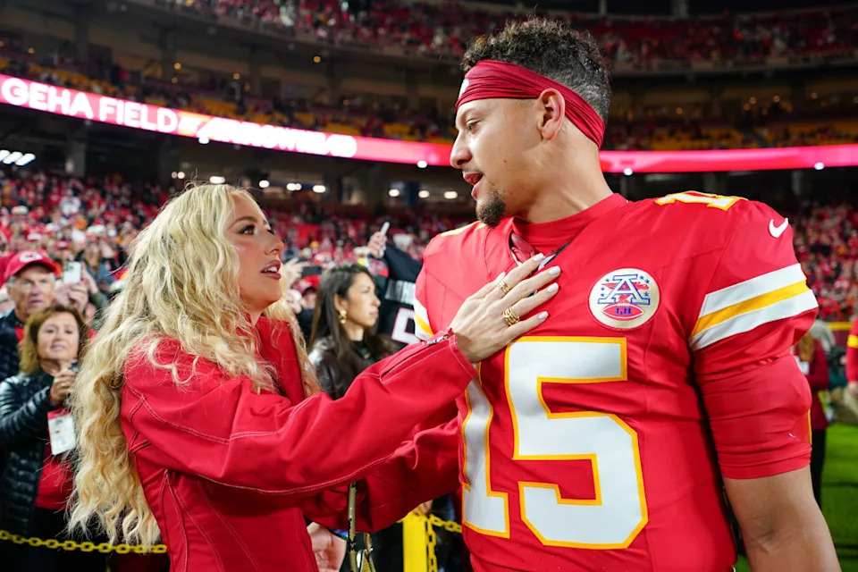 Kansas City Chiefs quarterback Patrick Mahomes (15) greets his wife Brittany Mahomes.Denny Medley-Imagn Images