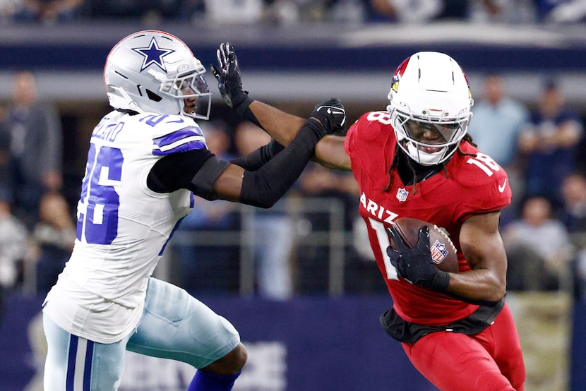 Arizona Cardinals wide receiver Marvin Harrison Jr. (18) avoids a tackle attempt from Dallas...