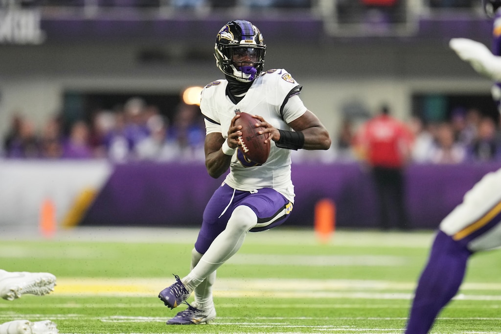 Baltimore Ravens quarterback Lamar Jackson scrambles in the second half of an NFL football game against the Minnesota Vikings, Sunday, Nov. 9, 2025, in Minneapolis.