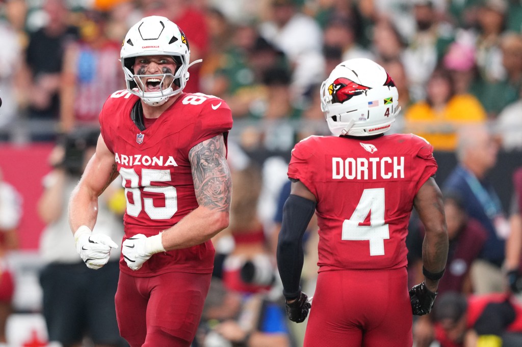 Cardinals tight end Trey McBride (85) celebrates scoring a touchdown against the Packers on Oct. 19, 2025.