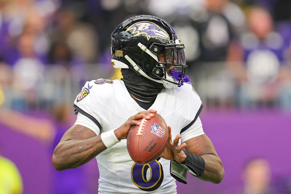 Nov 9, 2025; Minneapolis, Minnesota, USA; Baltimore Ravens quarterback Lamar Jackson (8) passes against the Minnesota Vikings in the first quarter at U.S. Bank Stadium. Mandatory Credit: Brad Rempel-Imagn Images
