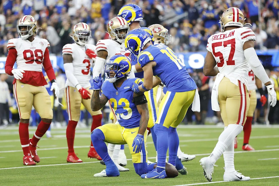 Cam Akers (23) and Cooper Kupp (10, right) of the Los Angeles Rams following a play in the first quarter against the San Francisco 49ers in the NFC Championship Game at SoFi Stadium on January 30, 2022 in Inglewood, California. (Photo by Christian Petersen/Getty Images)