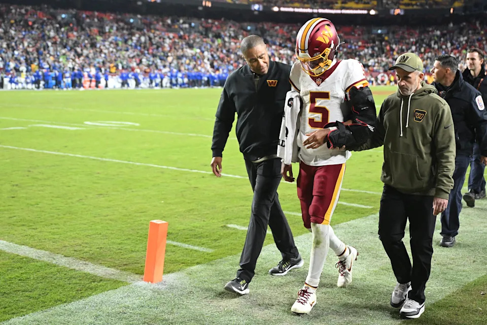 LANDOVER, MARYLAND - NOVEMBER 02: Jayden Daniels #5 of the Washington Commanders walks to the locker room after injuring his left arm during the fourth quarter against the Seattle Seahawks in the game at Northwest Stadium on November 02, 2025 in Landover, Maryland. (Photo by Greg Fiume/Getty Images)