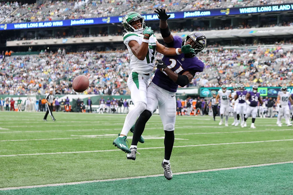 EAST RUTHERFORD, NEW JERSEY - SEPTEMBER 11: Brandon Stephens #21 of the Baltimore Ravens breaks up a pass intended for Garrett Wilson #17 of the New York Jets during the game at MetLife Stadium on September 11, 2022 in East Rutherford, New Jersey. (Photo by Mike Stobe/Getty Images)