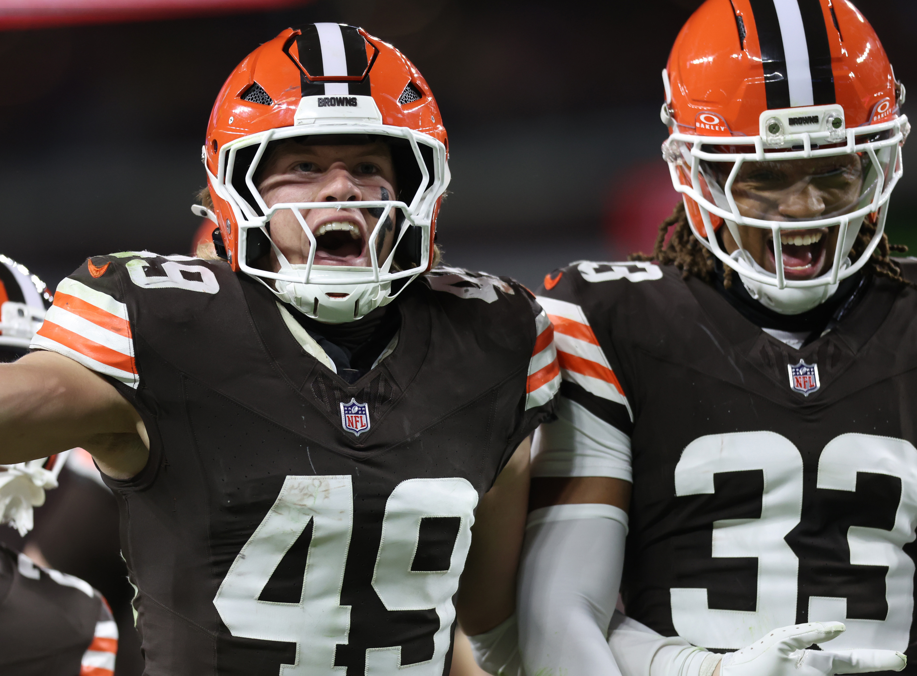 Cleveland Browns linebacker Carson Schwesinger (L)  celebrates his third quarter interception with teammate safety Ronnie Hickman against the Baltimore Ravens.  