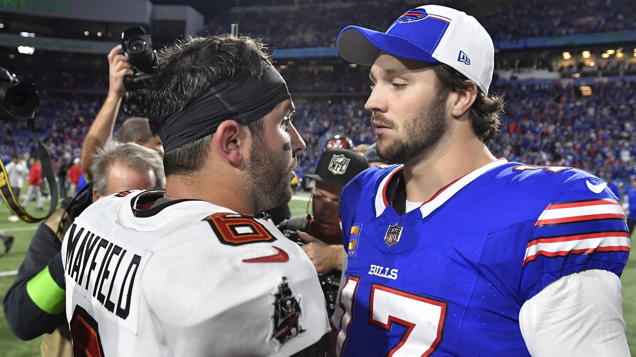 Tampa Bay Buccaneers quarterback Baker Mayfield, left, and Buffalo Bills quarterback Josh Allen, right, talk following their NFL football game, Thursday, Oct. 26, 2023, in Orchard Park, N.Y. (AP Photo/Adrian Kraus)