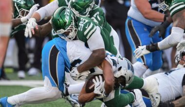 New York Jets defensive tackle Quinnen Williams (95) tackles Carolina Panthers running back Chuba Hubbard (30) during the fourth quarter of an NFL football game, Sunday, Oct. 19, 2025, in East Rutherford, N.J. (AP Photo/Seth Wenig)