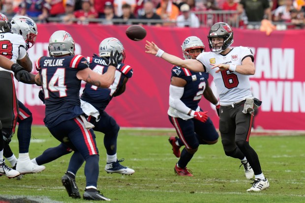 Tampa Bay Buccaneers quarterback Baker Mayfield (6) throws against the New England Patriots during the first half of an NFL football game Sunday, Nov. 9, 2025, in Tampa, Fla. (AP Photo/Chris O'Meara)