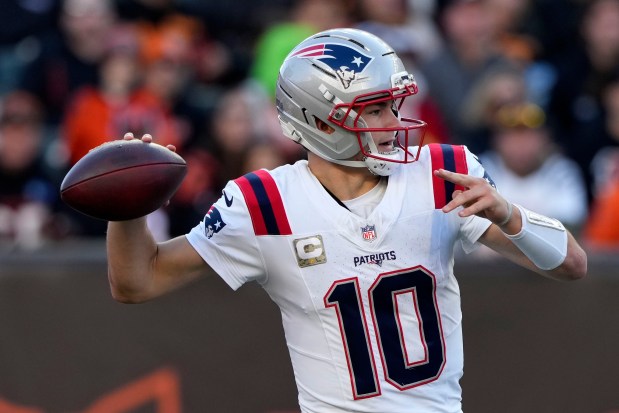 New England Patriots quarterback Drake Maye throws a pass during the second half of an NFL football game against the Cincinnati Bengals, Sunday, Nov. 23, 2025, in Cincinnati. (AP Photo/Carolyn Kaster)