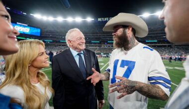 Music artist Post Malone, center, meets with Dallas Cowboys owner Jerry Jones before an NFL football game against the New York Giants, Thursday, Sept. 26, 2024, in East Rutherford, N.J. (AP Photo/Bryan Woolston)
