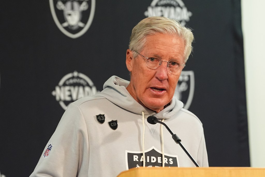 Coach Josh McDaniels speaking at a press conference.