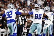 Dallas Cowboys defensive tackle Quinnen Williams (92) and defensive tackle Kenny Clark (95)...