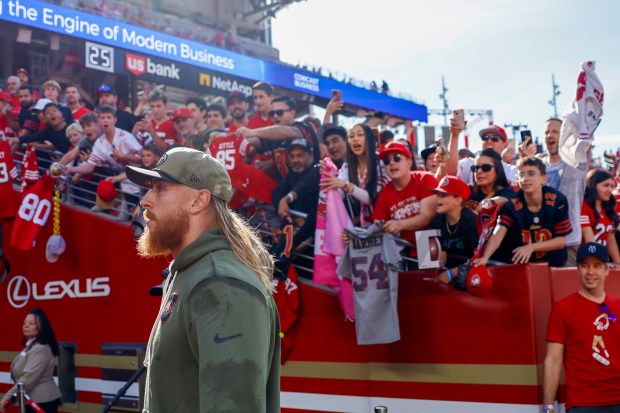 San Francisco 49ers' George Kittle (85) signs autographs during warmups at Levi's Stadium in Santa Clara, Calif., on Sunday, Nov. 9, 2025. (Shae Hammond/Bay Area News Group)