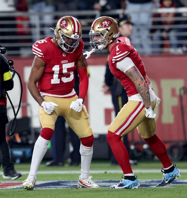San Francisco 49ers' Jauan Jennings #15 and Ricky Pearsall #1 celebrate Jenning's touchdown in the first quarter of their NFL game against the Carolina Panthers at Levi's Stadium in Santa Clara, Calif., on Monday, Nov. 24, 2025. (Jane Tyska/Bay Area News Group)