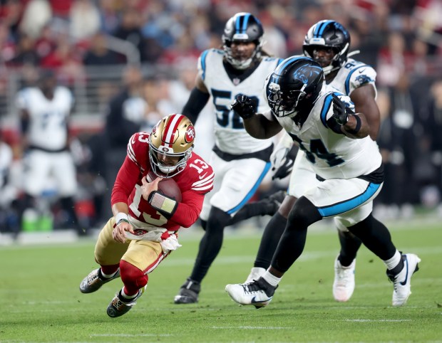San Francisco 49ers quarterback Brock Purdy #13 gains yardage on a keeper in the first quarter of their NFL game against the Carolina Panthers at Levi's Stadium in Santa Clara, Calif., on Monday, Nov. 24, 2025. (Jane Tyska/Bay Area News Group)