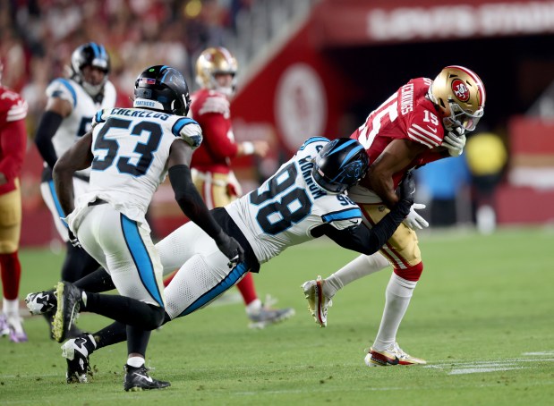 San Francisco 49ers' Jauan Jennings #15 is tackled by Carolina Panthers' D.J. Wonnum #98 in the first quarter of their NFL game at Levi's Stadium in Santa Clara, Calif., on Monday, Nov. 24, 2025. (Jane Tyska/Bay Area News Group)