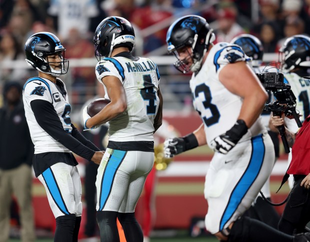 Carolina Panthers' Tetairoa McMillan #4 celebrates his touchdown with quarterback Bryce Young #9 in the third quarter of their NFL game at Levi's Stadium in Santa Clara, Calif., on Monday, Nov. 24, 2025. (Jane Tyska/Bay Area News Group)