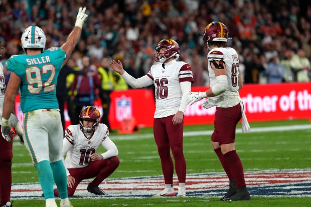 Washington Commanders kicker Matt Gay (16) stands on the field after missing a 56-yard field goal attempt against the Miami Dolphins in the second half of an NFL football game in Madrid, Spain, on Sunday, Nov. 16, 2025. (Dave Shopland/AP Content Services for the NFL)