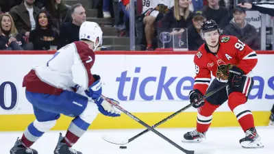 Nov 23, 2025; Chicago, Illinois, USA; Colorado Avalanche defenseman Devon Toews (7) defends against Chicago Blackhawks center Connor Bedard (98) during the first period at United Center.