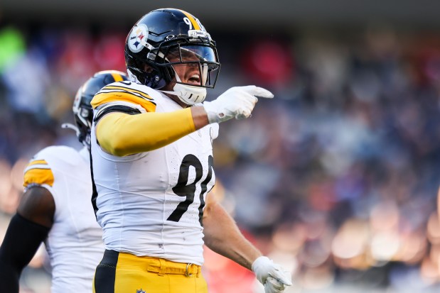 Steelers linebacker T.J. Watt celebrates after sacking Bears quarterback Caleb Williams to cause a fumble resulting in a Pittsburgh touchdown during the second quarter on Sunday, Nov. 23, 2025, at Soldier Field. (Eileen T. Meslar/Chicago Tribune)