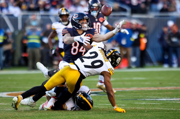 Bears tight end Colston Loveland juggles a pass from quarterback Caleb Williams while covered by Steelers safety Kyle Dugger (29) and linebacker Payton Wilson during the fourth quarter Sunday, Nov. 23, 2025, at Soldier Field. (Eileen T. Meslar/Chicago Tribune)