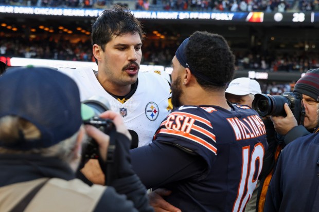 Bears quarterback Caleb Williams hugs Steelers quarterback Mason Rudolph after the Bears' 31-28 victory Sunday, Nov. 23, 2025, at Soldier Field. (Eileen T. Meslar/Chicago Tribune)