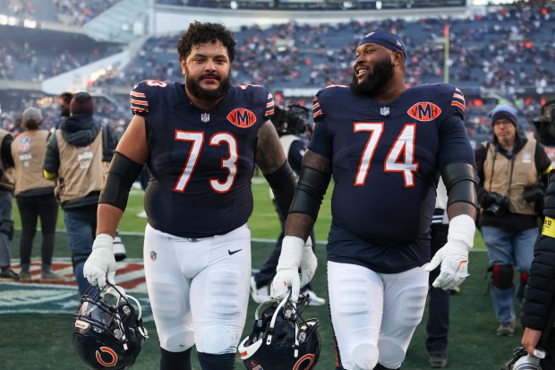 Bears guards Jonah Jackson (73) and Jordan McFadden (74) smile as they walk off the field after defeating the Steelers 31-28 on Sunday, Nov. 23, 2025, at Soldier Field. (Eileen T. Meslar/Chicago Tribune)