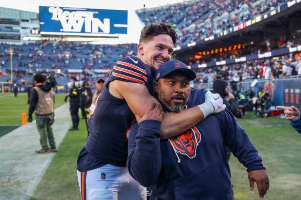 Bears tight end Nikola Kalinic celebrates with special teams coordinator Richard Hightower after defeating the Steelers 31-28 on Sunday, Nov. 23, 2025, at Soldier Field. (Eileen T. Meslar/Chicago Tribune)
