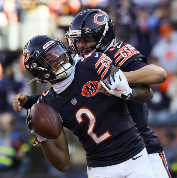Bears wide receiver DJ Moore (2) is congratulated by quarterback Caleb Williams after a touchdown reception in the first quarter against the Steelers on Sunday, Nov. 23, 2025, at Soldier Field. (John J. Kim/Chicago Tribune)