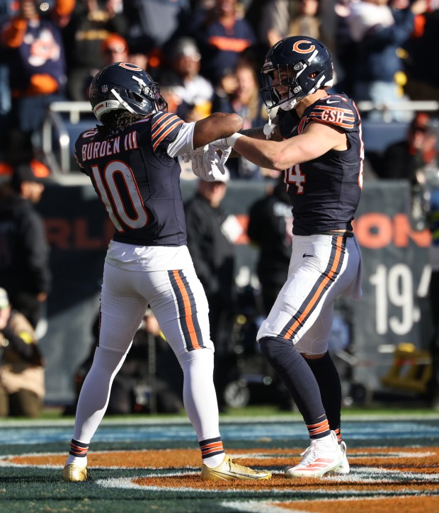 Bears tight end Colston Loveland, right, celebrates after a touchdown reception in the second quarter against the Steelers on Sunday, Nov. 23, 2025, at Soldier Field. (John J. Kim/Chicago Tribune)