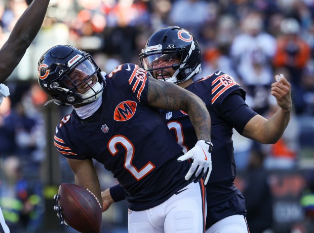 Bears wide receiver DJ Moore (2) is congratulated by quarterback Caleb Williams after a touchdown reception in the first quarter against the Steelers on Sunday, Nov. 23, 2025, at Soldier Field. (John J. Kim/Chicago Tribune)