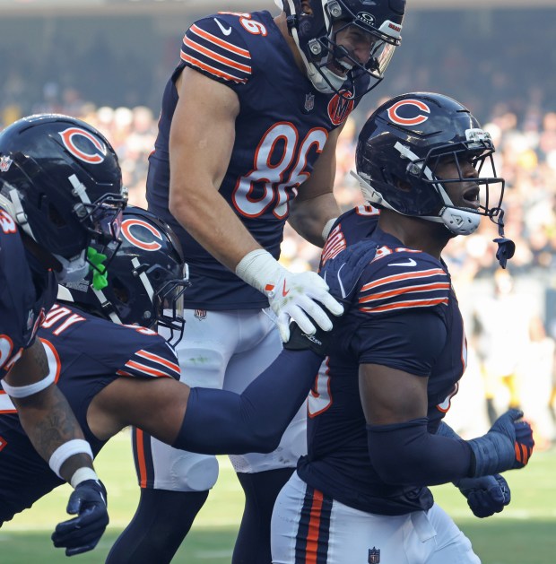 Bears defensive end Dominique Robinson (90) celebrates with teammates after a tackle on a Steelers kickoff return in the first quarter Sunday, Nov. 23, 2025, at Soldier Field. (John J. Kim/Chicago Tribune)