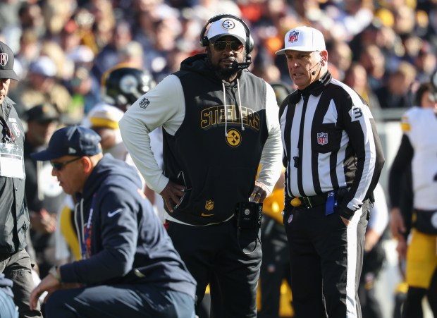 Steelers coach Mike Tomlin watches as medical staff tend to Bears linebacker Ruben Hyppolite II in the first quarter Sunday, Nov. 23, 2025, at Soldier Field. (John J. Kim/Chicago Tribune)