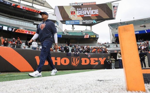 Bears general manager Ryan Poles walks the perimeter of the...