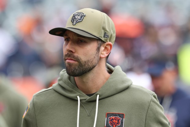 Bears offensive coordinator Declan Doyle watches players warm up for...