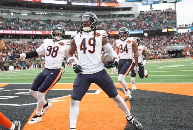 Bears linebacker Tremaine Edmunds celebrates with teammates after making an...